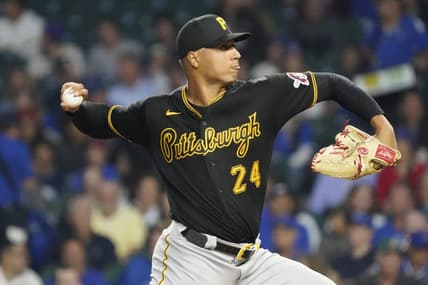 Sep 21, 2023; Chicago, Illinois, USA; Pittsburgh Pirates starting pitcher Johan Oviedo (24) throws the ball against the Chicago Cubs during the first inning at Wrigley Field. Mandatory Credit: David Banks-USA TODAY Sports