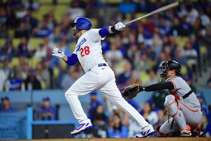 Sep 21, 2023; Los Angeles, California, USA; Los Angeles Dodgers designated hitter J.D. Martinez (28) hits a solo home run against the San Francisco Giants during the fourth inning at Dodger Stadium. Mandatory Credit: Gary A. Vasquez-USA TODAY Sports