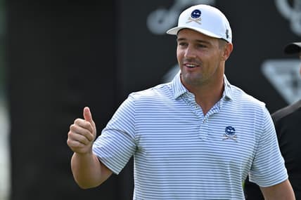 Sep 22, 2023; Sugar Grove, Illinois, USA; Bryson DeChambeau interacts with fans while warming up during the first round of the LIV Golf Chicago golf tournament at Rich Harvest Farms. Mandatory Credit: Jamie Sabau-USA TODAY Sports