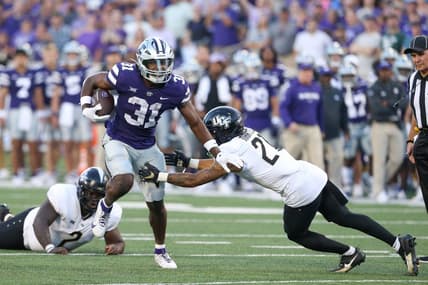 Sep 23, 2023; Manhattan, Kansas, USA; UCF Knights defensive back Nikai Martinez (21) misses a tackle on Kansas State Wildcats running back DJ Giddens (31) during the first quarter at Bill Snyder Family Football Stadium. Mandatory Credit: Scott Sewell-USA TODAY Sports