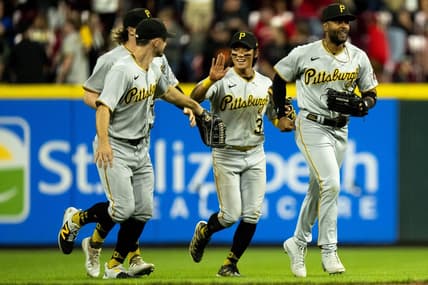 Sep 23, 2023; Cincinnati, Ohio, USA; Pittsburgh Pirates second baseman Ji Hwan Bae (3) high fives left fielder Bryan Reynolds (10) as right fielder Joshua Palacios (54), right runs ahead of them after winning at Great American Ball Park. Mandatory Credit: The Cincinnati Enquirer-USA TODAY Sports