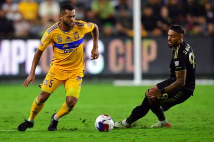 Sep 27, 2023; Los Angeles, CA, USA; Los Angeles FC forward Denis Bouanga (99) and Tigres UANL midfielder Rafael Carioca (5) battle for the ball in the second half at BMO Stadium. Mandatory Credit: Gary A. Vasquez-USA TODAY Sports