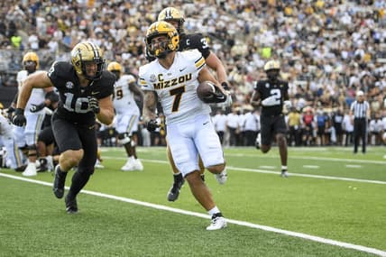 Sep 30, 2023; Nashville, Tennessee, USA; Missouri Tigers running back Cody Schrader (7) scores on a one-yard run against the Vanderbilt Commodores during the first half at FirstBank Stadium. Mandatory Credit: Steve Roberts-USA TODAY Sports
