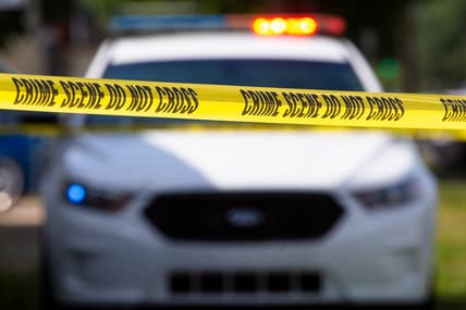 Crime scene tape near a squad car.

Police File Photo