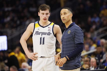 Dec 16, 2022; Milwaukee, Wisconsin, USA;  Marquette Golden Eagles head coach Shaka Smart talks with guard Tyler Kolek (11) during the game against the Creighton Bluejays at Fiserv Forum. Mandatory Credit: Jeff Hanisch-USA TODAY Sports