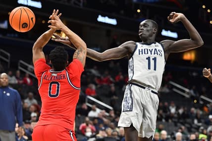 Feb 22, 2023; Washington, District of Columbia, USA; Georgetown Hoyas forward Akok Akok (11) and St. John's Red Storm guard Posh Alexander (0) battle for a rebound during the first half at Capital One Arena. Mandatory Credit: Brad Mills-USA TODAY Sports