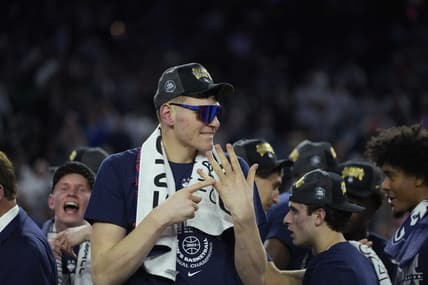 Apr 3, 2023; Houston, TX, USA; Connecticut Huskies center Donovan Clingan (32) celebrates after defeating the San Diego State Aztecs in the national championship game of the 2023 NCAA Tournament at NRG Stadium. Mandatory Credit: Bob Donnan-USA TODAY Sports