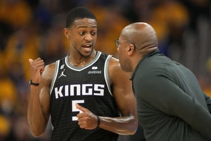Apr 23, 2023; San Francisco, California, USA; Sacramento Kings guard De'Aaron Fox (5) talks to head coach Mike Brown during the second quarter of game four of the 2023 NBA playoffs against the Golden State Warriors at Chase Center. Mandatory Credit: Darren Yamashita-USA TODAY Sports