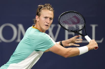 Aug 9, 2023; Toronto, Ontario, Canada; Sebastian Korda (USA) chases a ball hit by Aleksandar Vukic (not pictured) at Sobeys Stadium. Mandatory Credit: John E. Sokolowski-USA TODAY Sports