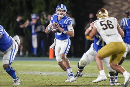 Sep 30, 2023; Durham, North Carolina, USA;Duke Blue Devils quarterback Riley Leonard (13) looks for a receiver  during the second half against the Notre Dame Fighting Irish at Wallace Wade Stadium. Mandatory Credit: Jim Dedmon-USA TODAY Sports