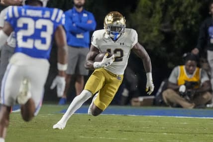 Sep 30, 2023; Durham, North Carolina, USA; Notre Dame Fighting Irish running back Jeremiyah Love (12) runs for yards after catch against the Duke Blue Devils during the second half at Wallace Wade Stadium. Mandatory Credit: Jim Dedmon-USA TODAY Sports