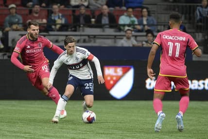 Oct 4, 2023; Vancouver, British Columbia, CAN;  Vancouver Whitecaps FC midfielder Ryan Gauld (25) controls the ball against St. Louis City SC midfielder Eduard Lowen (10) during the first half at BC Place. Mandatory Credit: Anne-Marie Sorvin-USA TODAY Sports