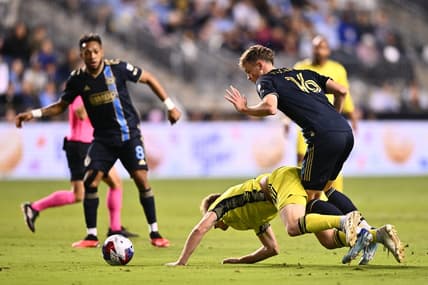 Oct 7, 2023; Philadelphia, Pennsylvania, USA; Philadelphia Union midfielder Jack McGlynn (16) and Nashville SC midfielder Dax McCarty (6) battle for position in the first half at Subaru Park. Mandatory Credit: Kyle Ross-USA TODAY Sports