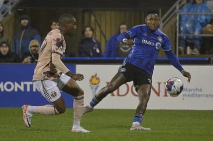Oct 7, 2023; Montreal, Quebec, CAN; CF Montreal forward Romell Quioto (30) passes the ball against Portland Timbers defender Juan Mosquera (29) in the first half at Stade Saputo. Mandatory Credit: Eric Bolte-USA TODAY Sports