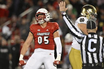 Oct 7, 2023; Louisville, Kentucky, USA;  Louisville Cardinals defensive lineman Mason Reiger (95) reacts after sacking Notre Dame Fighting Irish quarterback Sam Hartman (10) during the first half at L&N Federal Credit Union Stadium. Mandatory Credit: Jamie Rhodes-USA TODAY Sports