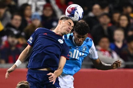 Oct 7, 2023; Chicago, Illinois, USA;  Chicago Fire FC forward Georgios Koutsias (19) and Charlotte FC defender Adilson Malanda (29) battle for control of the ball in the first half at Soldier Field. Mandatory Credit: Jamie Sabau-USA TODAY Sports