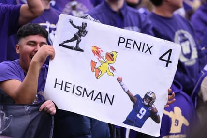 Oct 14, 2023; Seattle, Washington, USA; Fans hold up a Michael Penix Jr. (9) (not pictured) sign during the second half of the game between the Washington Huskies and the Oregon Ducks at Alaska Airlines Field at Husky Stadium. Mandatory Credit: Steven Bisig-USA TODAY Sports