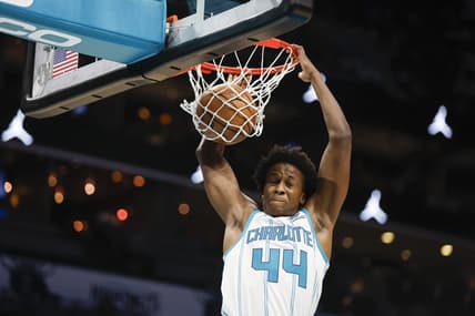 Oct 15, 2023; Charlotte, North Carolina, USA; Charlotte Hornets center Nick Richards Charlotte Hornets guard Frank Ntilikina (44) dunks against the Oklahoma City Thunder in the second half at Spectrum Center. Mandatory Credit: Nell Redmond-USA TODAY Sports