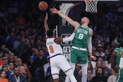 Oct 25, 2023; New York, New York, USA; Boston Celtics center Kristaps Porzingis (8) blocks a shot taken by New York Knicks guard RJ Barrett (9) in the first quarter at Madison Square Garden. Mandatory Credit: Wendell Cruz-USA TODAY Sports