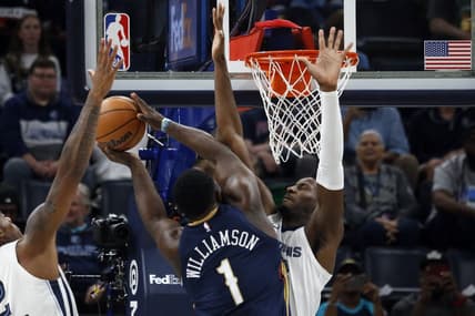 Oct 25, 2023; Memphis, Tennessee, USA; Memphis Grizzlies forward-center Jaren Jackson Jr. (13) defends as New Orleans Pelicans forward Zion Williamson (1) drives to the basket during the first half at FedExForum. Mandatory Credit: Petre Thomas-USA TODAY Sports