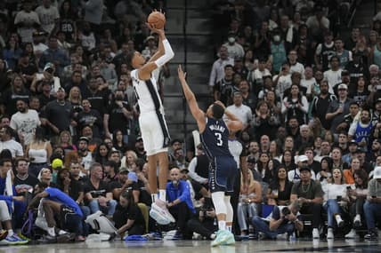 Oct 25, 2023; San Antonio, Texas, USA;  San Antonio Spurs center Victor Wembanyama (1) shoots over Dallas Mavericks forward Grant Williams (3) in the second half at the Frost Bank Center. Mandatory Credit: Daniel Dunn-USA TODAY Sports