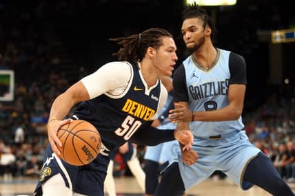 Oct 27, 2023; Memphis, Tennessee, USA; Denver Nuggets forward Aaron Gordon (50) moves to the basket as Memphis Grizzlies forward Ziaire Williams (8) defends during the first half at FedExForum. Mandatory Credit: Petre Thomas-USA TODAY Sports