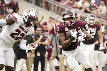 Oct 28, 2023; College Station, Texas, USA; Texas A&M Aggies wide receiver Ainias Smith (0) runs for a touchdown against the South Carolina Gamecocks during the second quarter at Kyle Field. Mandatory Credit: Dustin Safranek-USA TODAY Sports