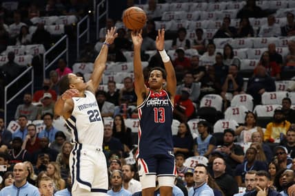 Oct 28, 2023; Washington, District of Columbia, USA; Washington Wizards guard Jordan Poole (13) shoots the ball over Memphis Grizzlies guard Desmond Bane (22) in the first quarter at Capital One Arena. Mandatory Credit: Geoff Burke-USA TODAY Sports
