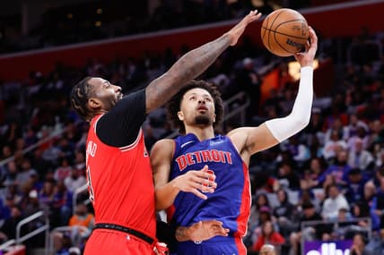 Oct 28, 2023; Detroit, Michigan, USA;  Detroit Pistons guard Cade Cunningham (2) shoots on Chicago Bulls center Andre Drummond (3) in the first half at Little Caesars Arena. Mandatory Credit: Rick Osentoski-USA TODAY Sports