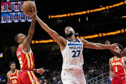 Oct 30, 2023; Atlanta, Georgia, USA; Minnesota Timberwolves center Rudy Gobert (27) and Atlanta Hawks guard Dejounte Murray (5) fight for a rebound during the first half at State Farm Arena. Mandatory Credit: Dale Zanine-USA TODAY Sports