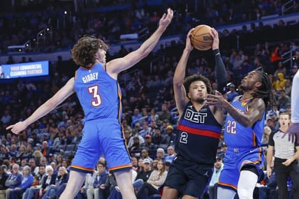 Oct 30, 2023; Oklahoma City, Oklahoma, USA; Detroit Pistons guard Cade Cunningham (2) drives to the basket between Oklahoma City Thunder guard Josh Giddey (3) and guard Cason Wallace (22) during the second half at Paycom Center. Oklahoma City won 124-112. Mandatory Credit: Alonzo Adams-USA TODAY Sports