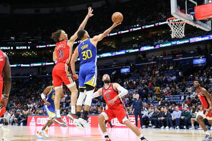 Oct 30, 2023; New Orleans, Louisiana, USA; Golden State Warriors guard Stephen Curry (30) drives to the basket against New Orleans Pelicans guard Dyson Daniels (11) and center Jonas Valanciunas (17) at Smoothie King Center. Mandatory Credit: Matthew Dobbins-USA TODAY Sports