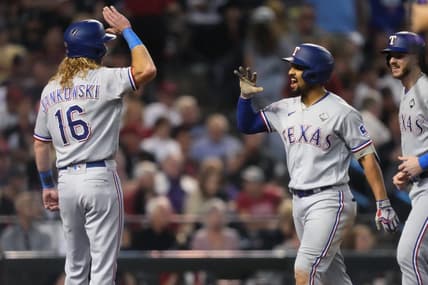 Texas Rangers right fielder Travis Jankowski (16) congratulates second baseman Marcus Semien (2) after a three-run home run during the third inning against the Arizona Diamondbacks in Game 4 of the 2023 World Series at Chase Field in Phoenix, AZ.