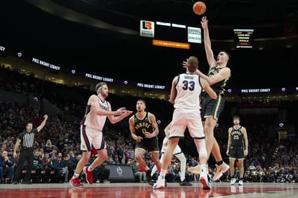 Nov 25, 2022; Portland, Oregon, USA;  Purdue Boilermakers center Zach Edey (15) shoots a basket during the second half against Gonzaga Bulldogs forward Ben Gregg (33) at Moda Center. Purdue won the game 84-66. Mandatory Credit: Troy Wayrynen-USA TODAY Sports