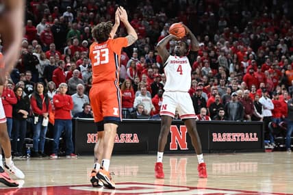 Jan 10, 2023; Lincoln, Nebraska, USA;  Nebraska Cornhuskers forward Juwan Gary (4) attempts a shot over Illinois Fighting Illini forward Coleman Hawkins (33) in the first half at Pinnacle Bank Arena. Mandatory Credit: Steven Branscombe-USA TODAY Sports