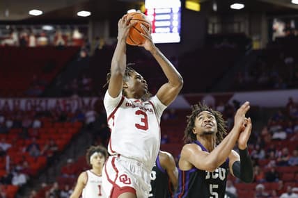 Mar 4, 2023; Norman, Oklahoma, USA; Oklahoma Sooners guard Otega Oweh (3) goes to the basket against TCU Horned Frogs forward Chuck O'Bannon Jr. (5) during the second half at Lloyd Noble Center. Oklahoma won 74-60. Mandatory Credit: Alonzo Adams-USA TODAY Sports