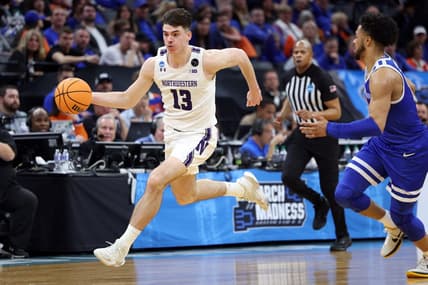 Mar 16, 2023; Sacramento, CA, USA; Northwestern Wildcats guard Brooks Barnhizer (13) controls the ball against Boise State Broncos guard Marcus Shaver Jr. (10) in the second half at Golden 1 Center. Mandatory Credit: Kelley L Cox-USA TODAY Sports