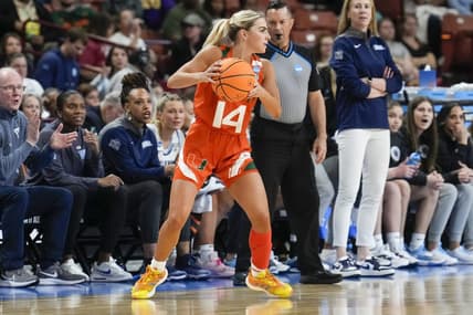 Mar 24, 2023; Greenville, SC, USA; Miami Hurricanes guard Haley Cavinder (14) looks for an open teammate against the Villanova Wildcats during the NCAA Women   s Tournament at Bon Secours Wellness Arena. Mandatory Credit: Jim Dedmon-USA TODAY Sports