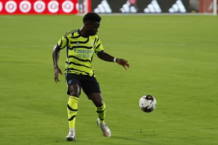 Jul 19, 2023; Washington, DC, USA; Arsenal midfielder Bukayo Saka (7) dribbles the ball against MLS All-Stars in the 2023 MLS All Star Game at Audi Field. Mandatory Credit: Geoff Burke-USA TODAY Sports