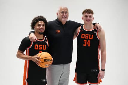 Oct 11, 2023; Las Vegas, NV, USA; Oregon State Beavers coach Wayne Tinkle (center) poses with guard Jordan Pope (0) and forward Tyler Bilodeau (34) during Pac-12 Media Day at Park MGM Las Vegas Conference Center. Mandatory Credit: Kirby Lee-USA TODAY Sports
