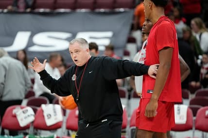 Oct 19, 2023; Columbus, Ohio, USA; Ohio State Buckeyes assistant coach Brandon Bailey works with Zed Key during an open practice at Value City Arena.
