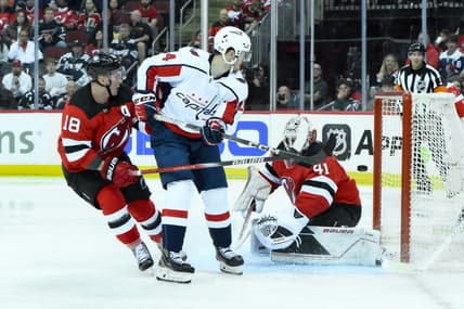 Oct 25, 2023; Newark, New Jersey, USA; Washington Capitals center Connor McMichael (24) scores a goal against New Jersey Devils goaltender Vitek Vanecek (41) during the third period at Prudential Center. Mandatory Credit: John Jones-USA TODAY Sports