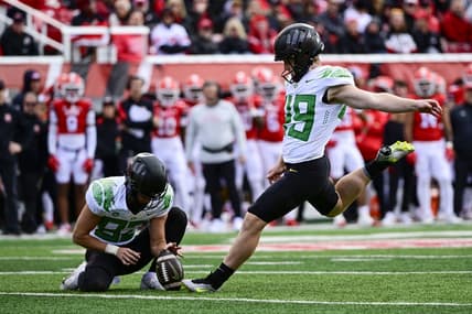 Oct 28, 2023; Salt Lake City, Utah, USA; Oregon Ducks kicker Camden Lewis (49) kicks a PAT against the Utah Utes during the first half at Rice-Eccles Stadium. Mandatory Credit: Christopher Creveling-USA TODAY Sports