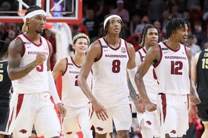 Oct 28, 2023; Fayetteville, AR, USA; Arkansas Razorbacks guard El Ellis (3) Khalif Battle (0) and guard Truman Mark (12) along with forward Trevon Brazil (2) and forward Chandler Lawson (8) celebrate after a score against the Purdue Boilermakers at Bud Walton Arena. Arkansas won 81-77. Mandatory Credit: Nelson Chenault-USA TODAY Sports