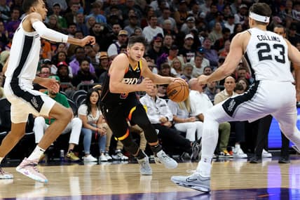 Oct 31, 2023; Phoenix, Arizona, USA; Phoenix Suns guard Grayson Allen #8 drives to the net agaisnt San Antonio Spurs center Victor Wembanyama #1 and forward Jeremy Sochan #10 during the second quarter at Footprint Center. Mandatory Credit: Zachary BonDurant-USA TODAY Sports