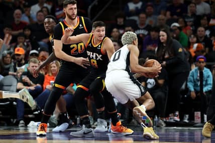 Oct 31, 2023; Phoenix, Arizona, USA; San Antonio Spurs forward Jeremy Sochan #10 drives to the net agaisnt Phoenix Suns guard Grayson Allen #8 and center Jusuf Nurkic #20 during the second half at Footprint Center. Mandatory Credit: Zachary BonDurant-USA TODAY Sports