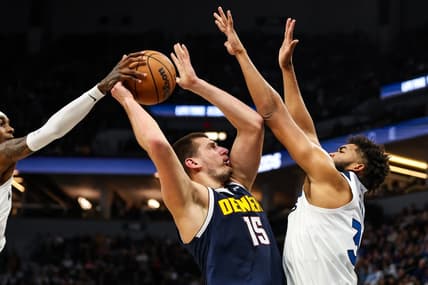 Nov 1, 2023; Minneapolis, Minnesota, USA; Minnesota Timberwolves forward Jaden McDaniels (3) blocks a shot by Denver Nuggets center Nikola Jokic (15) during the first half at Target Center. Mandatory Credit: Matt Krohn-USA TODAY Sports