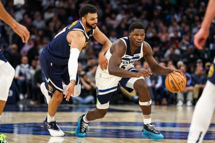 Nov 1, 2023; Minneapolis, Minnesota, USA; Minnesota Timberwolves guard Anthony Edwards (5) drives while Denver Nuggets guard Jamal Murray (27) defends during the second half at Target Center. Mandatory Credit: Matt Krohn-USA TODAY Sports
