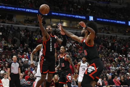 Nov 3, 2023; Chicago, Illinois, USA; Chicago Bulls forward Torrey Craig (13) and guard Coby White (0) chase a rebound against the Brooklyn Nets during the first half at the United Center. Mandatory Credit: Matt Marton-USA TODAY Sports