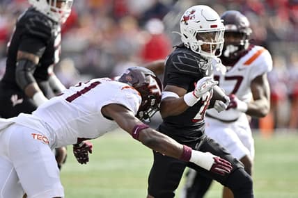 Nov 4, 2023; Louisville, Kentucky, USA;  Louisville Cardinals running back Jawhar Jordan (25) runs the ball against Virginia Tech Hokies linebacker Keli Lawson (21) during the first quarter at L&N Federal Credit Union Stadium. Mandatory Credit: Jamie Rhodes-USA TODAY Sports